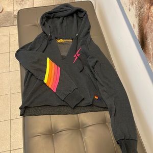 **New w/o tags. Ladies adorb cropped and cut neck neon lightning bolt/5 stripes.